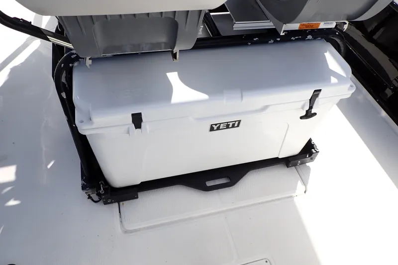Slide: The Image of YETI cooler on 2015 Blue Wave 2400 PureBay boat deck. - 20