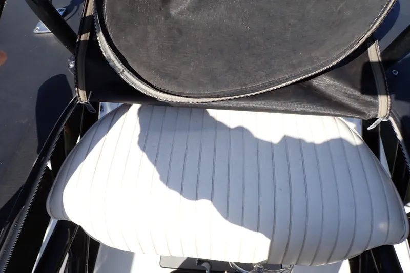 Slide: The Image of White cushioned seat on 2015 Blue Wave 2400 PureBay boat. - 90