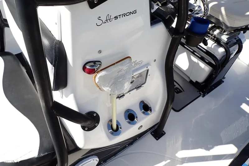 Slide: The Image of 2015 Blue Wave 2400 PureBay boat console with fishing rod holders and seating. - 54