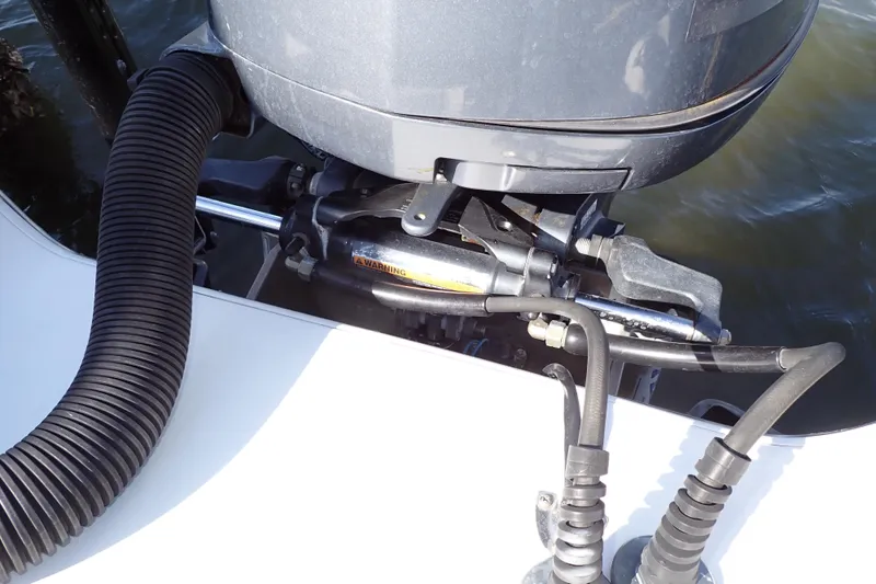 Slide: The Image of Close-up of a 2015 Blue Wave 2400 PureBay boat engine and hydraulic system. - 82
