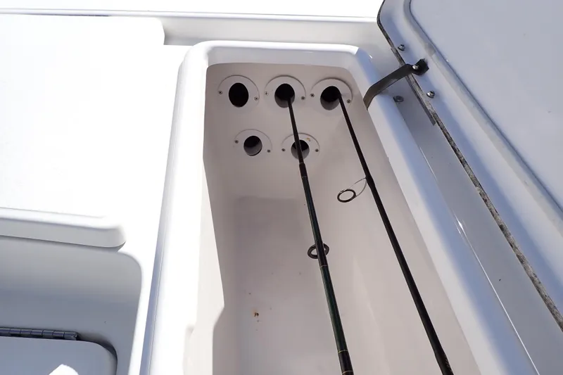 Slide: The Image of Rod storage compartment on a 2015 Blue Wave 2400 PureBay boat. - 50