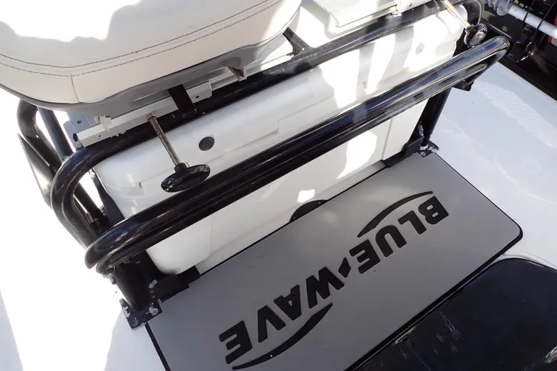 Slide: The Image of 2015 Blue Wave 2400 PureBay boat interior with branded mat and seating. - 60