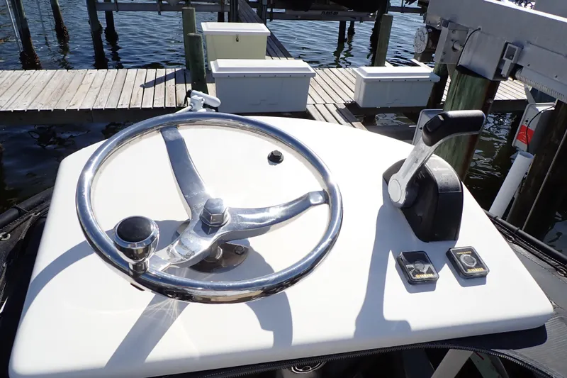 Slide: The Image of Steering console of 2015 Blue Wave 2400 PureBay boat at dock. - 87