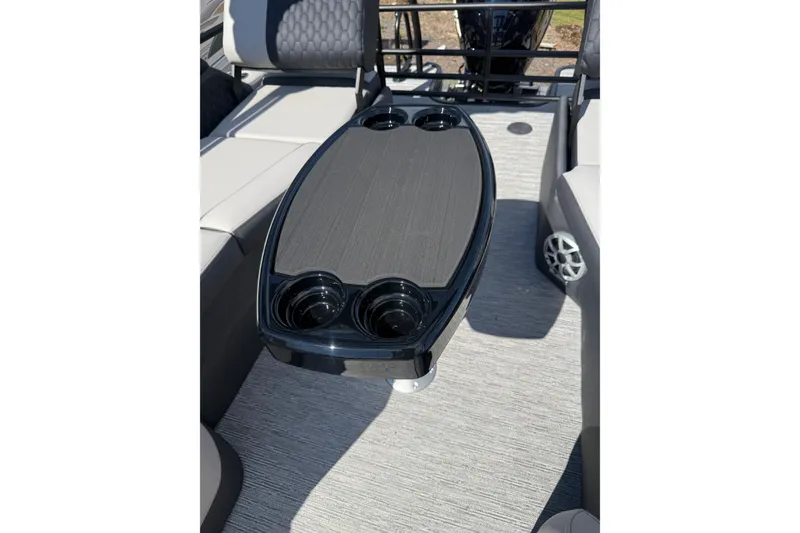 Slide: The Image of 2026 Sylvan L-3 LZ DH boat interior with sleek table and cup holders. - 30