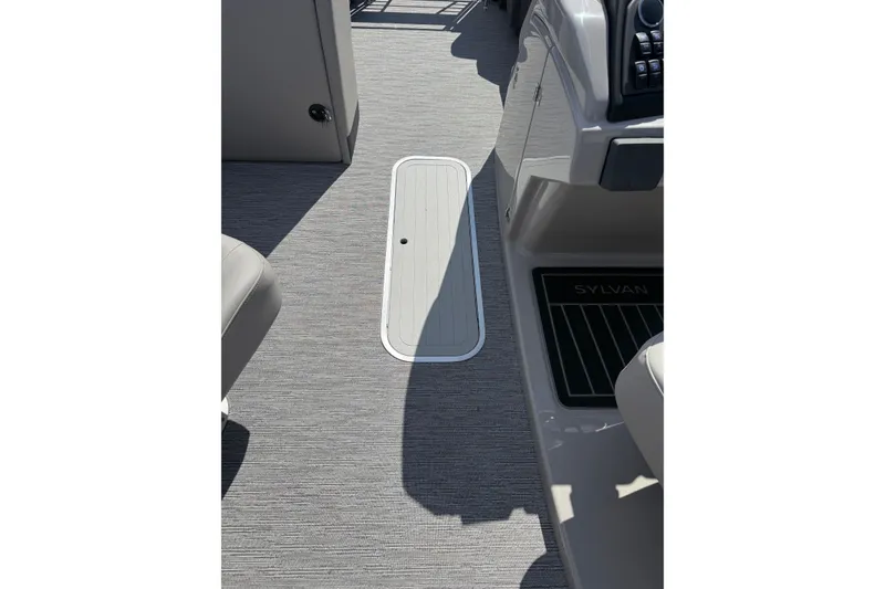 Slide: The Image of Interior view of 2026 Sylvan L-3 LZ DH boat, featuring sleek flooring and control panel. - 29
