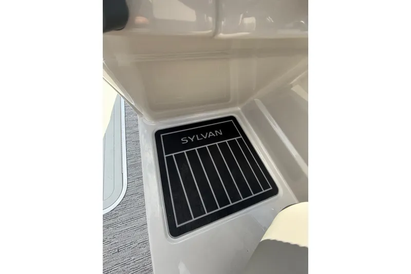 Slide: The Image of Floor mat with "Sylvan" logo in a 2026 Sylvan L-3 LZ DH boat interior. - 27