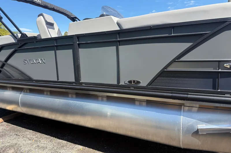 Slide: The Image of 2026 Sylvan L-3 LZ DH pontoon boat side view with sleek design and modern features. - 35