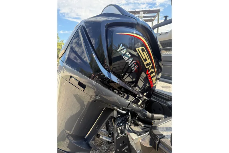 Slide: The Image of Yamaha outboard motor on 2026 Sylvan L-3 LZ DH boat, shiny black finish. - 32