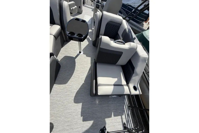 Slide: The Image of Luxurious seating on 2026 Sylvan L-3 LZ DH pontoon boat with table and cup holders. - 19