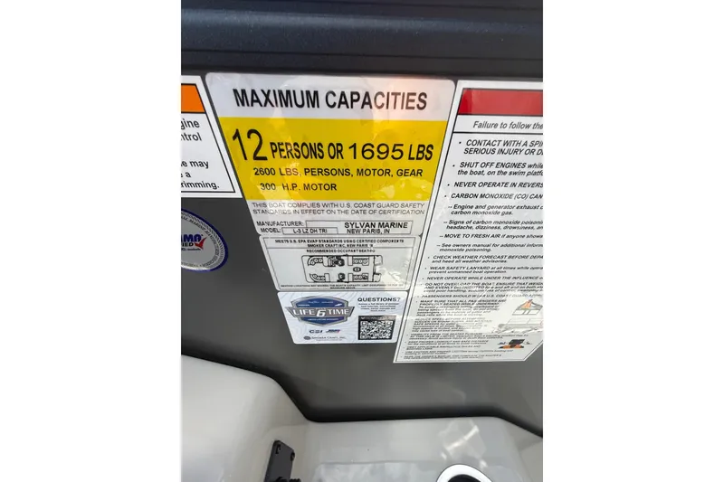 Slide: The Image of 2026 Sylvan L-3 LZ DH boat capacity label, 12 persons or 1695 lbs, 300 HP motor. - 28