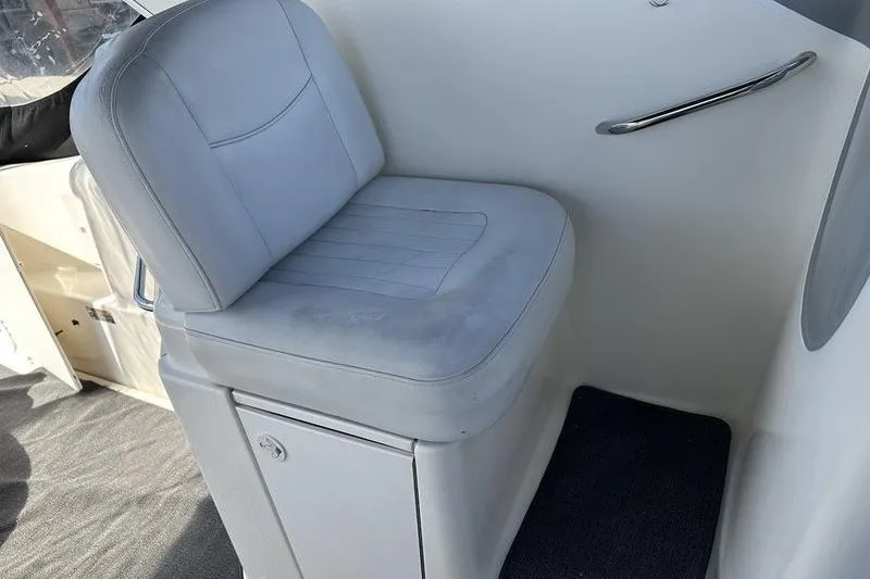 Slide: The Image of 2004 Bayliner 3055 Ciera Sunbridge boat seat with storage compartment. - 15