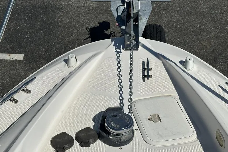 Slide: The Image of Bow of 2004 Bayliner 3055 Ciera Sunbridge with anchor chain and deck fittings. - 42