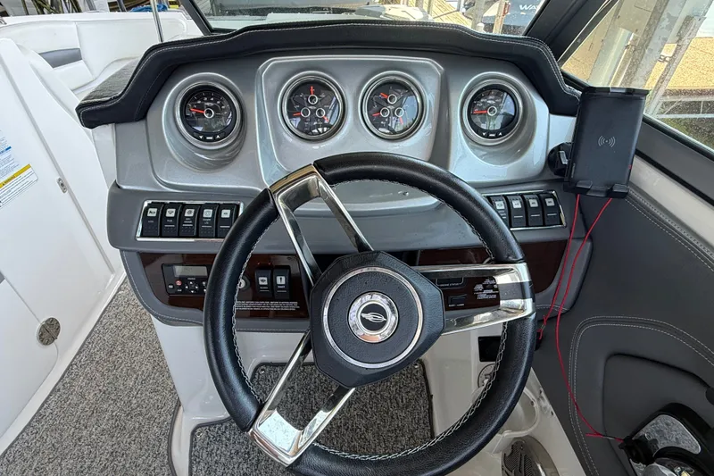 Slide: The Image of Steering console of 2014 Chaparral 224 Sunesta boat with gauges and controls. - 18