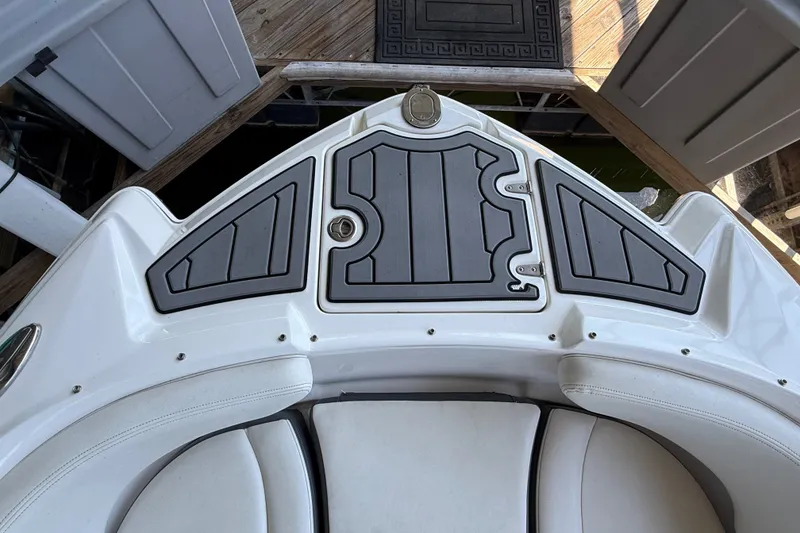 Slide: The Image of 2014 Chaparral 224 Sunesta boat bow with cushioned seating and non-slip deck. - 24