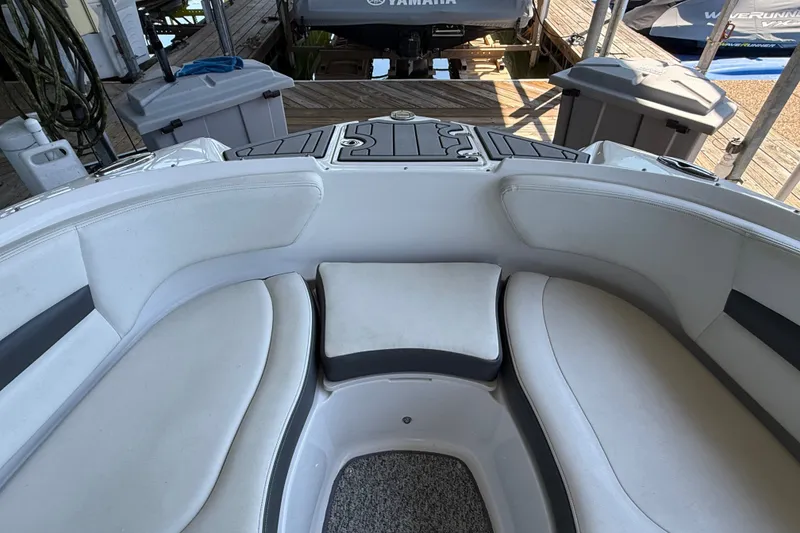 Slide: The Image of Interior view of 2014 Chaparral 224 Sunesta boat with cushioned seating. - 23