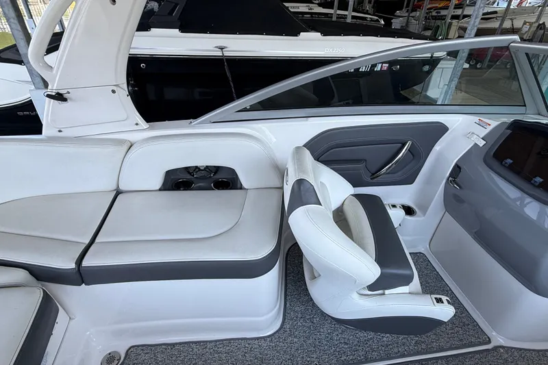 Slide: The Image of Interior of 2014 Chaparral 224 Sunesta boat with white and gray seating. - 13