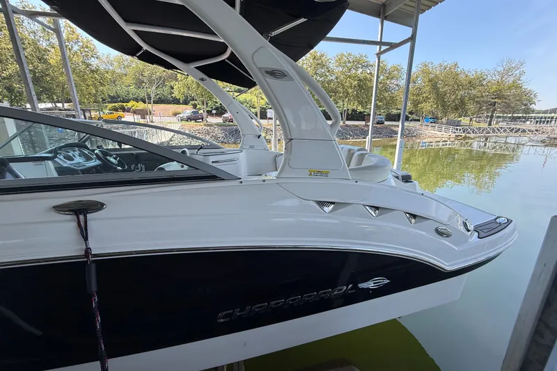 Slide: The Image of 2014 Chaparral 224 Sunesta boat docked, featuring sleek design and modern amenities. - 3