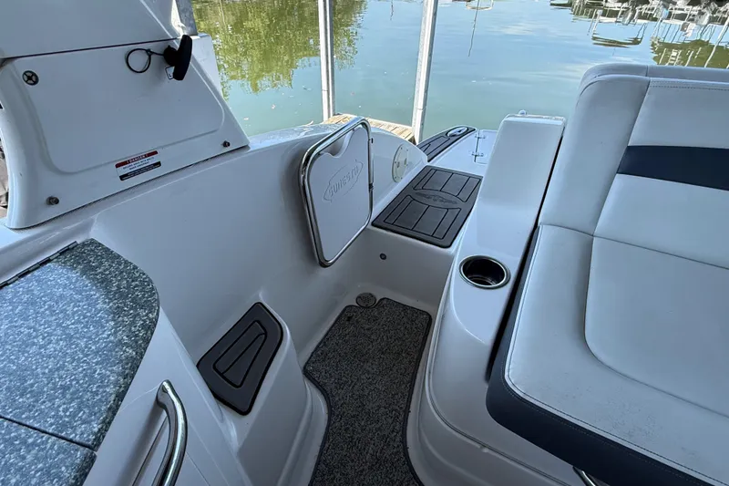 Slide: The Image of Interior view of 2014 Chaparral 224 Sunesta boat with seating and storage compartments. - 9