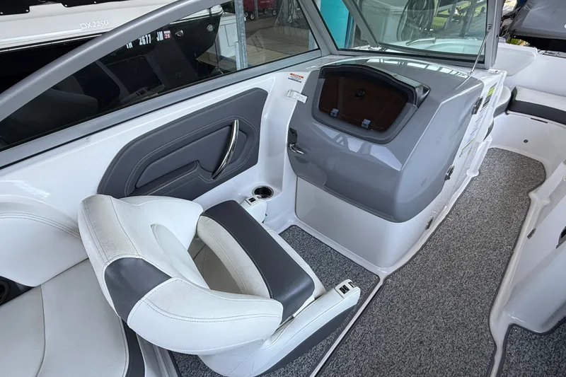 Slide: The Image of Interior of 2014 Chaparral 224 Sunesta boat with seating and dashboard. - 15