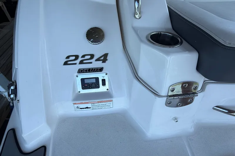 Slide: The Image of 2014 Chaparral 224 Sunesta boat deck with deluxe features and cup holder. - 29