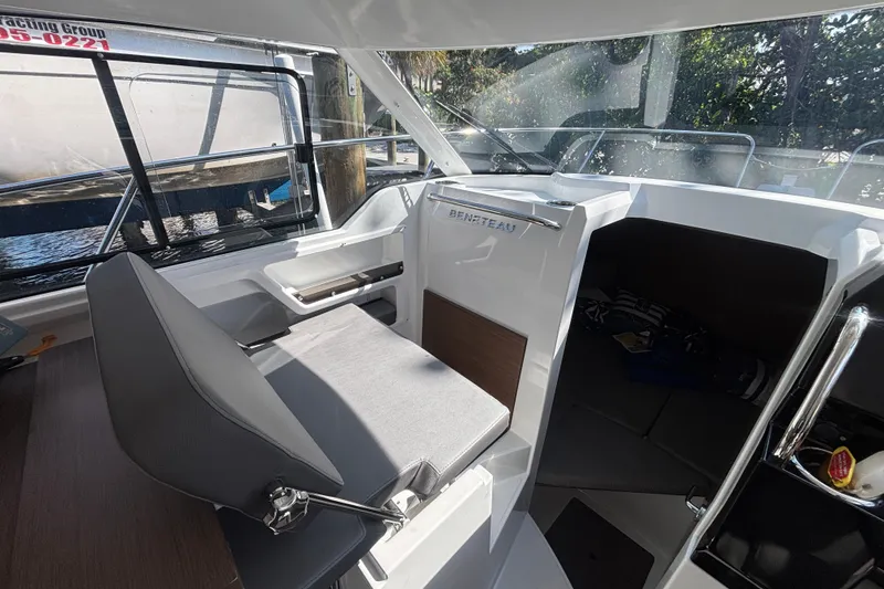 Slide: The Image of Interior of 2025 Beneteau Antares 8 boat, featuring helm and seating area. - 15