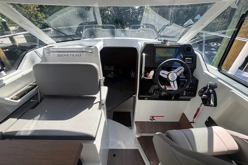 Slide: The Image of Interior view of 2025 Beneteau Antares 8 boat cockpit with steering wheel and navigation system. - 30