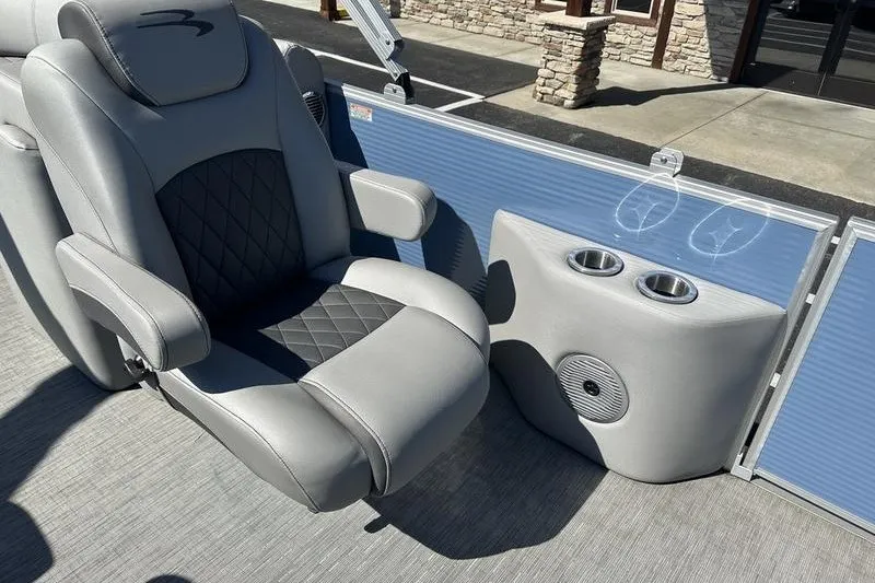 Slide: The Image of Luxury seating on 2022 Bennington 23 LSR boat with cup holders and speaker. - 16
