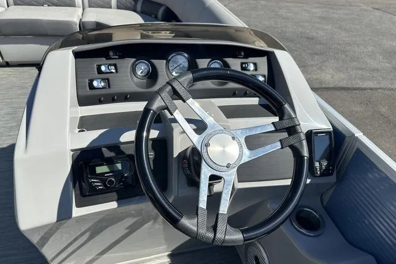 Slide: The Image of Steering console of 2022 Bennington 23 LSR boat with gauges and controls. - 15