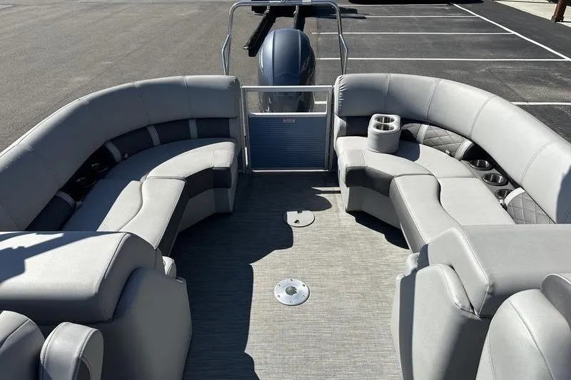 Slide: The Image of 2022 Bennington 23 LSR pontoon boat interior with plush seating and cup holders. - 21