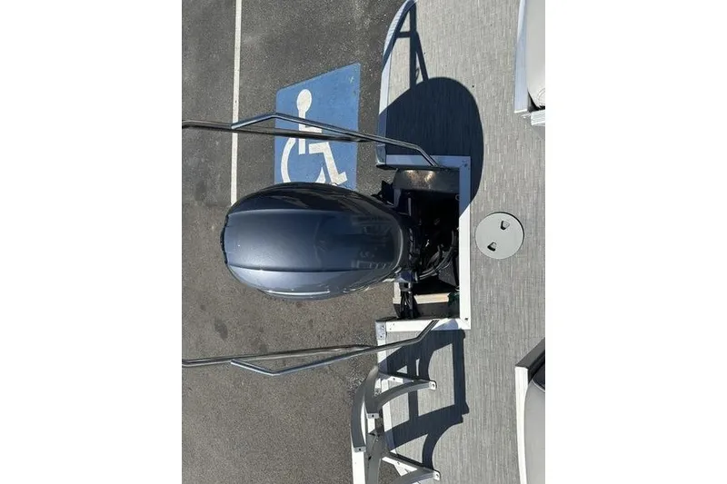 Slide: The Image of Top view of a 2022 Bennington 23 LSR boat engine near a handicap parking space. - 20