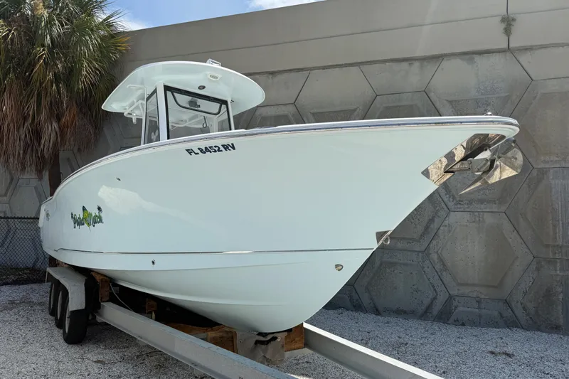 The Image of 2019 Sea Hunt Ultra 275SE boat on trailer, parked outdoors. - 1
