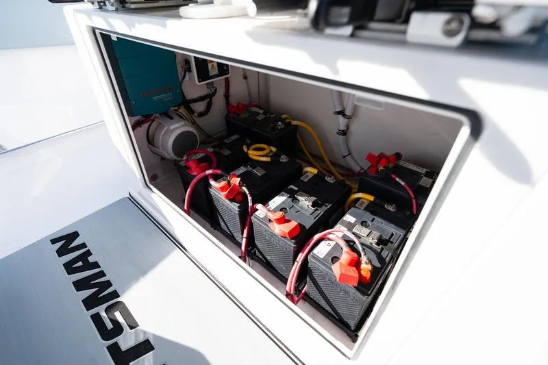 Slide: The Image of Battery compartment of 2027 Sportsman Open 232 Center Console boat, showcasing multiple batteries. - 34