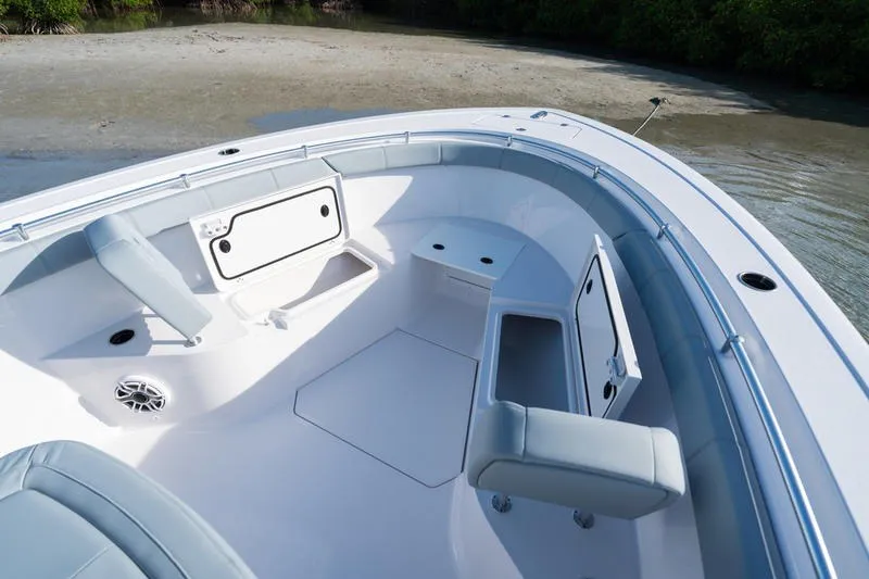 Slide: The Image of 2027 Sportsman Open 232 Center Console boat interior with seating and storage compartments. - 25