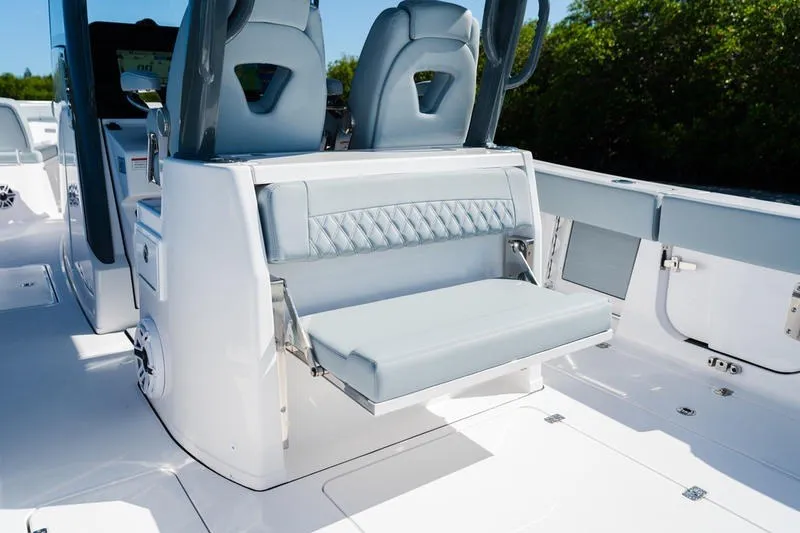 Slide: The Image of 2027 Sportsman Open 232 Center Console boat interior with sleek seating and modern design. - 33