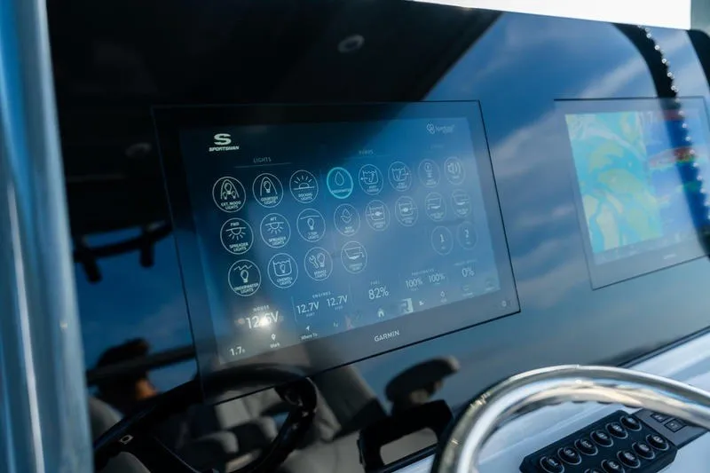 Slide: The Image of Dashboard of 2027 Sportsman Open 232 Center Console with digital display and controls. - 21