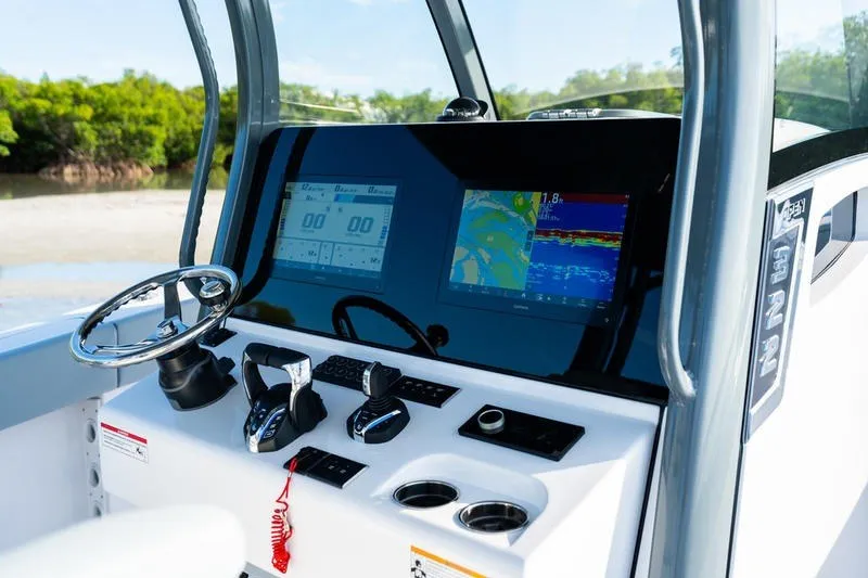 Slide: The Image of 2027 Sportsman Open 232 Center Console dashboard with modern navigation displays. - 1