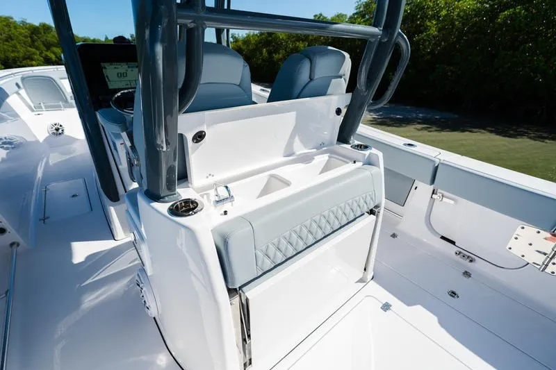 Slide: The Image of 2027 Sportsman Open 232 Center Console boat interior with seating and console details. - 37