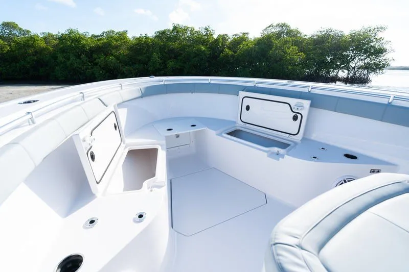 Slide: The Image of 2027 Sportsman Open 232 Center Console boat interior with storage compartments open. - 22