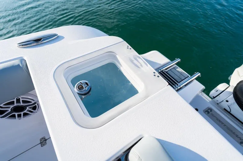 Slide: The Image of 2027 Sportsman Open 232 Center Console boat detail with livewell and ladder. - 16