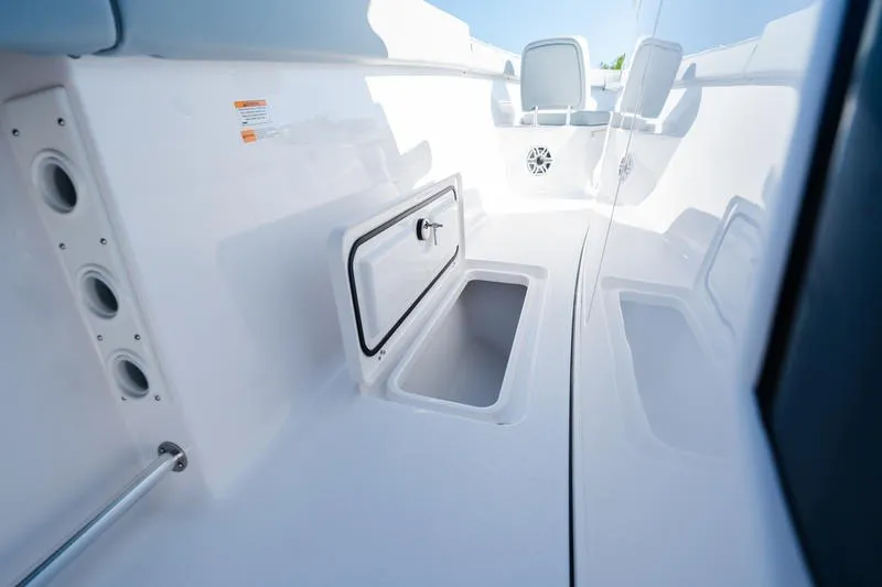 Slide: The Image of 2027 Sportsman Open 232 Center Console boat interior with storage compartments. - 4