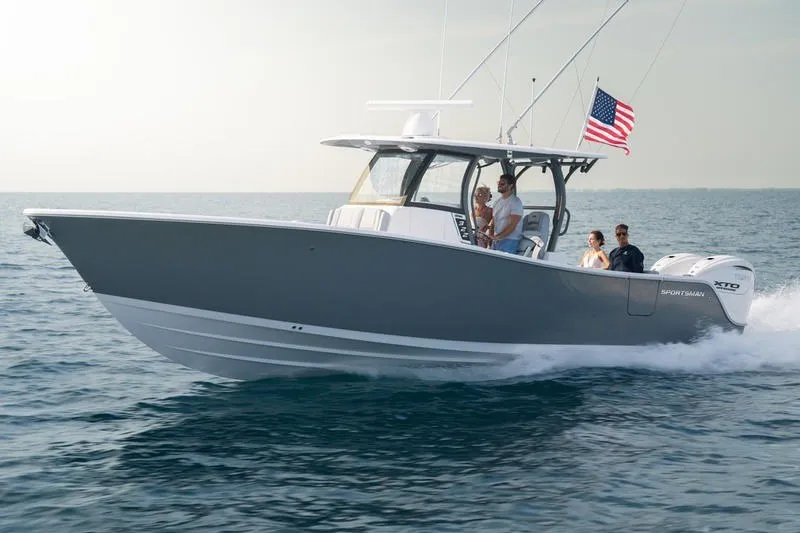 The Image of 2027 Sportsman Open 232 Center Console boat cruising on open water with passengers. - 10