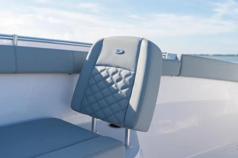 Slide: The Image of 2027 Sportsman Open 232 Center Console boat seat with quilted design and logo. - 26