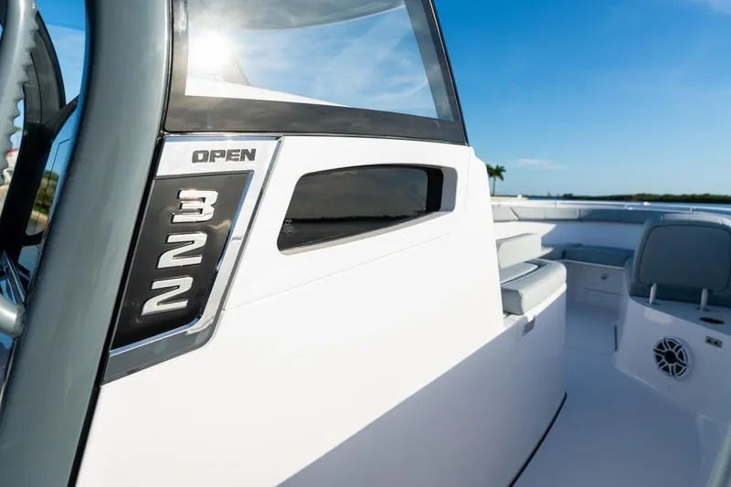 Slide: The Image of 2027 Sportsman Open 232 Center Console boat, sleek design, sunny day. - 12