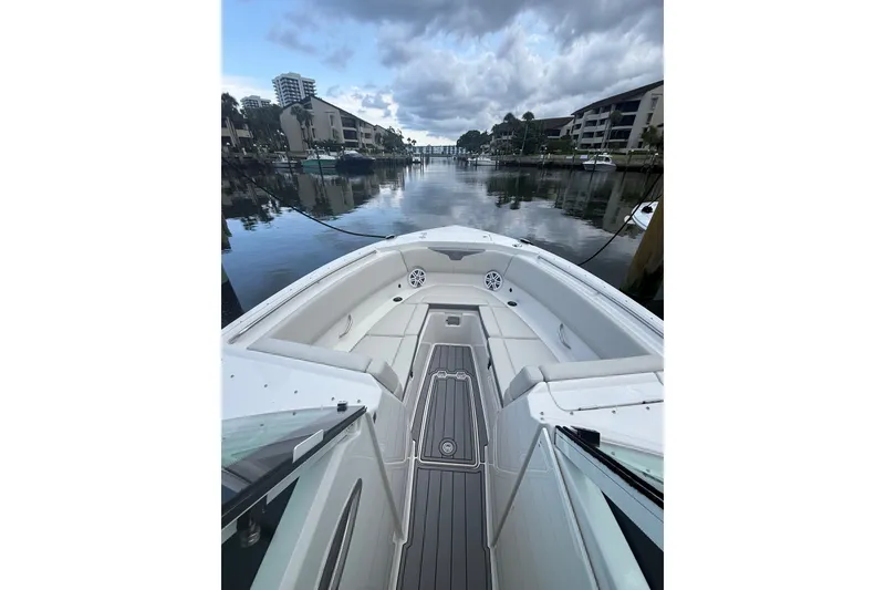 Slide: The Image of 2026 Sailfish 316 DC boat interior with sleek design, docked in a serene marina. - 3