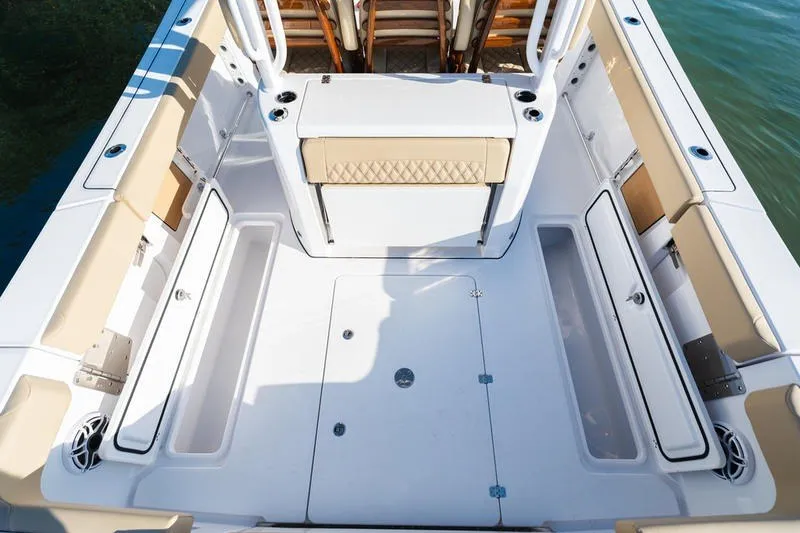 Slide: The Image of 2027 Sportsman Open 352 Center Console boat deck with seating and storage compartments. - 14