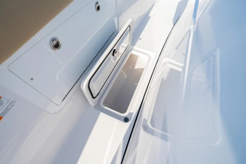 Slide: The Image of 2027 Sportsman Open 352 Center Console storage compartment detail. - 31