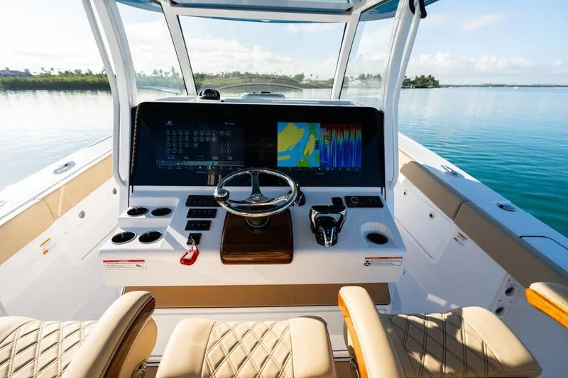 Slide: The Image of 2027 Sportsman Open 352 Center Console boat interior with advanced navigation system. - 36