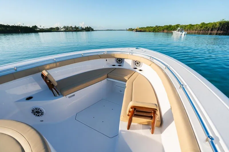 Slide: The Image of 2027 Sportsman Open 352 Center Console boat on calm water, featuring spacious seating. - 32