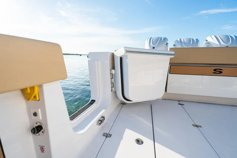 Slide: The Image of 2027 Sportsman Open 352 Center Console boat deck with sleek design and ocean view. - 47