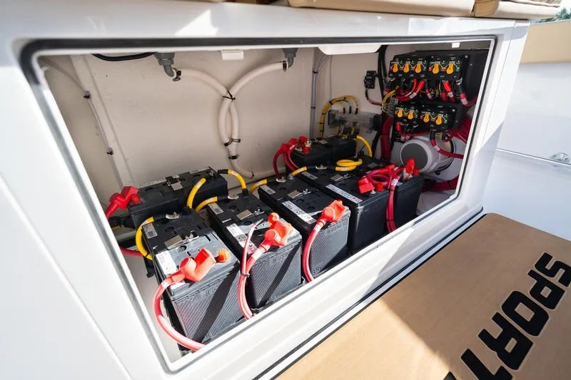 Slide: The Image of Battery compartment of 2027 Sportsman Open 352 Center Console boat, showcasing wiring and connections. - 40